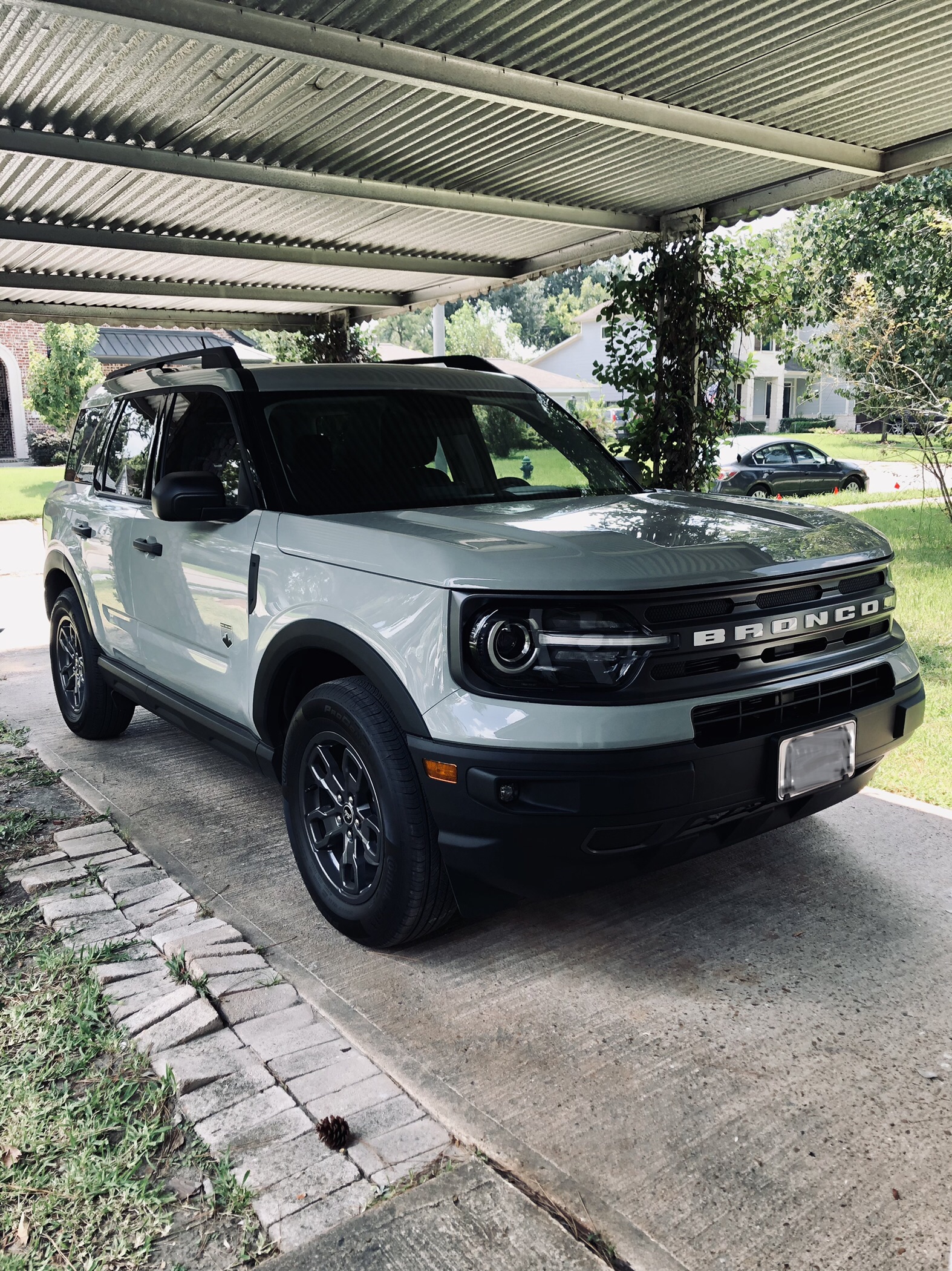 A 2021 cactus grey Bronco Sport parked in a driveway.